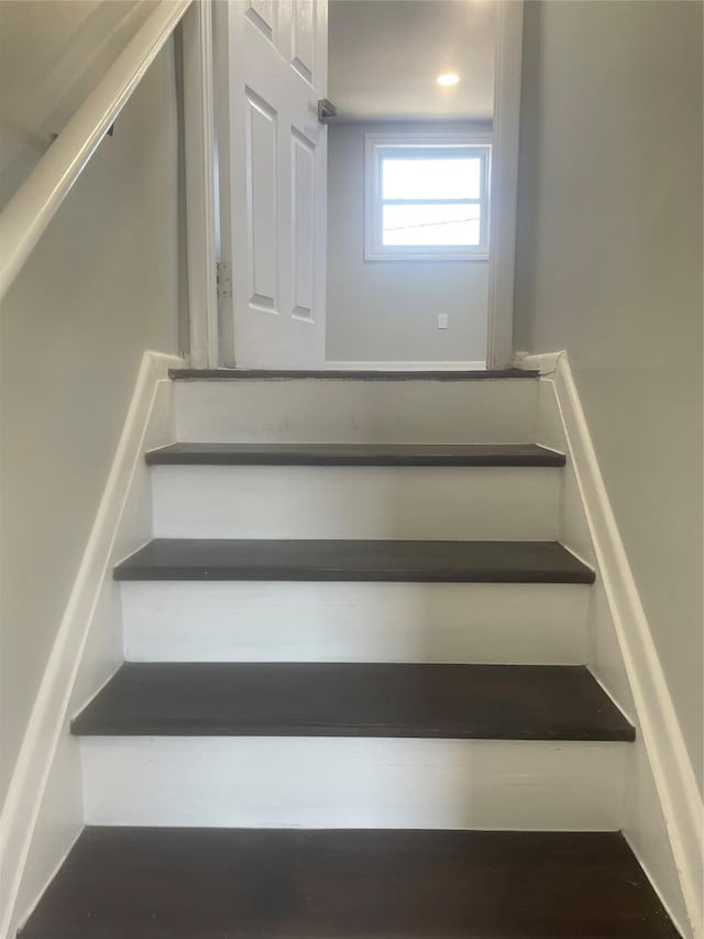 staircase with recessed lighting