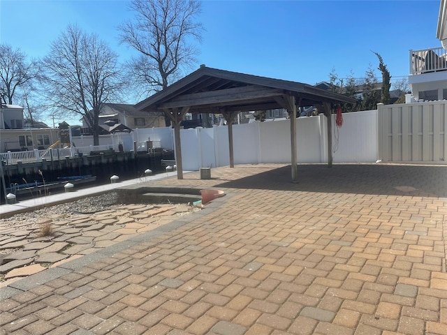 view of patio / terrace featuring fence and a gazebo