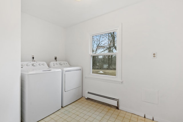 washroom with laundry area, a baseboard radiator, and washing machine and dryer