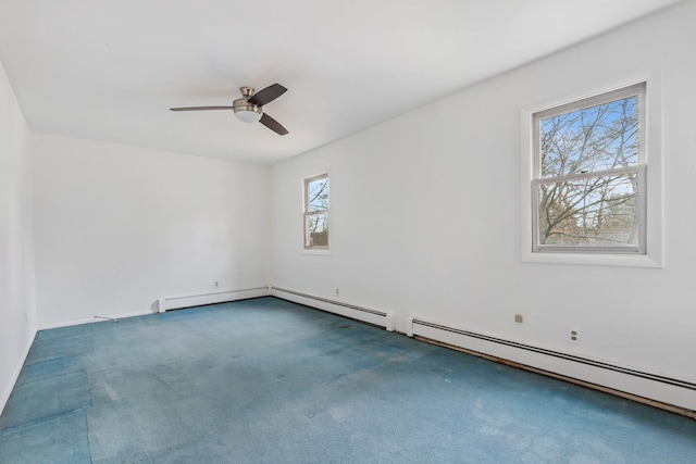 spare room featuring a ceiling fan, a baseboard heating unit, and carpet flooring