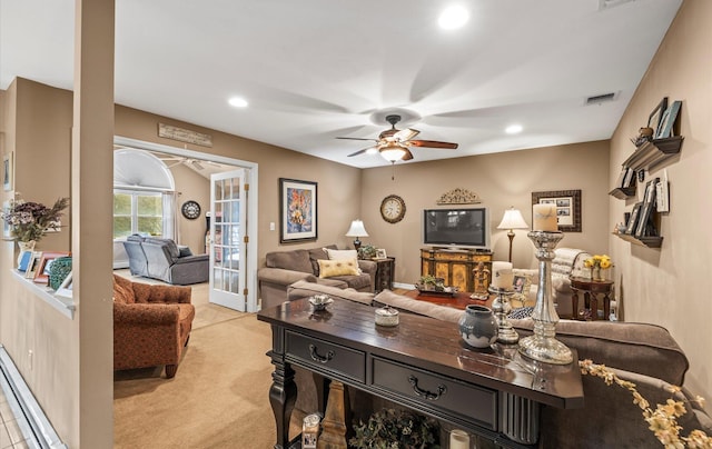 living area featuring ceiling fan, recessed lighting, light colored carpet, visible vents, and french doors