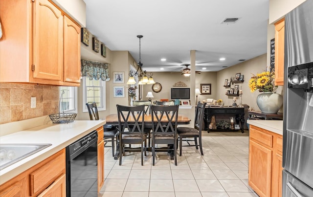 kitchen featuring light tile patterned floors, open floor plan, light countertops, dishwasher, and tasteful backsplash