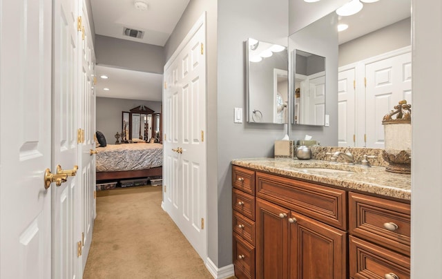 bathroom featuring ensuite bath, visible vents, and vanity