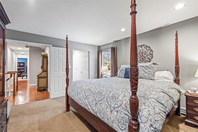 bedroom featuring carpet floors, visible vents, a closet, and recessed lighting