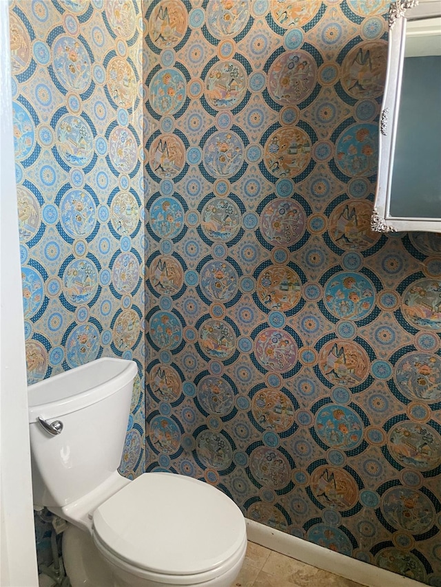 bathroom featuring toilet and tile patterned floors