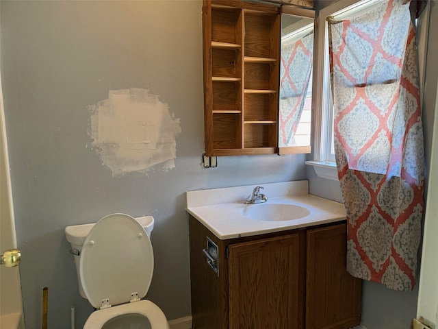 bathroom with vanity and toilet