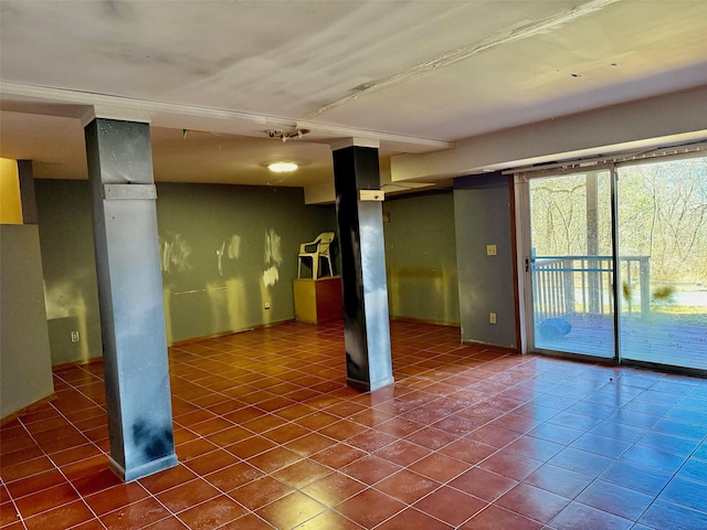 empty room with dark tile patterned flooring