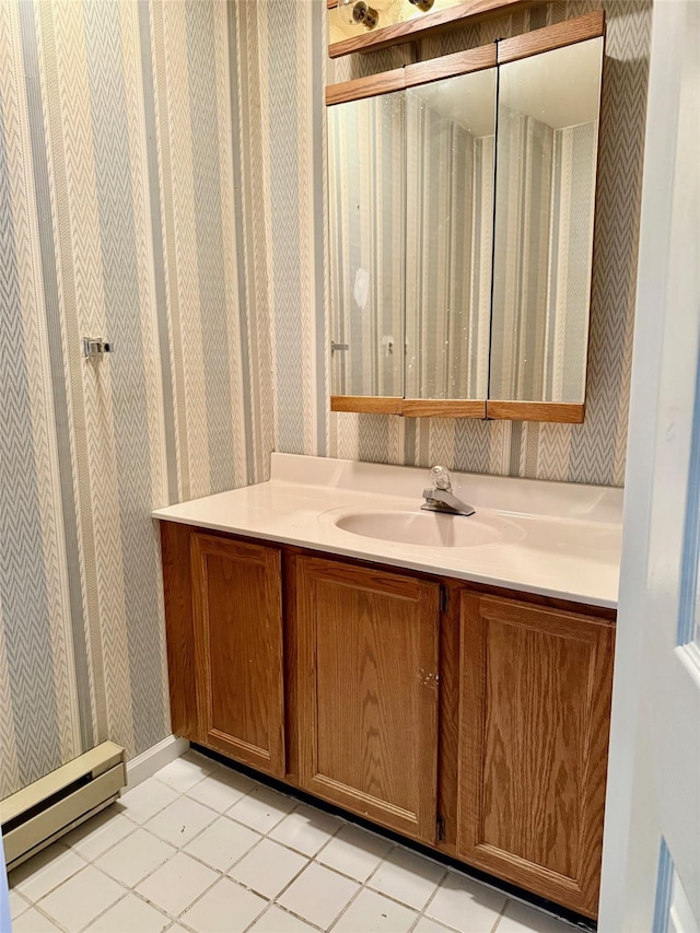 bathroom with vanity, a baseboard radiator, tile patterned floors, and wallpapered walls