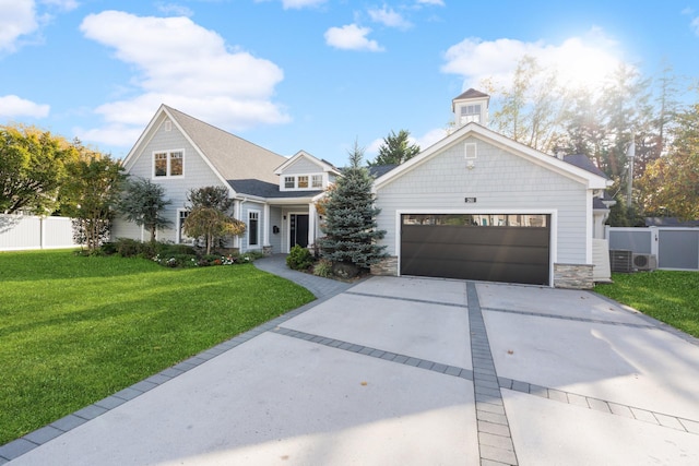 view of front of house with fence, a garage, stone siding, driveway, and a front lawn