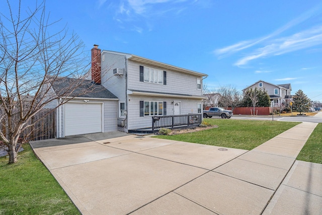 view of front of house with a garage, concrete driveway, a chimney, and a front lawn