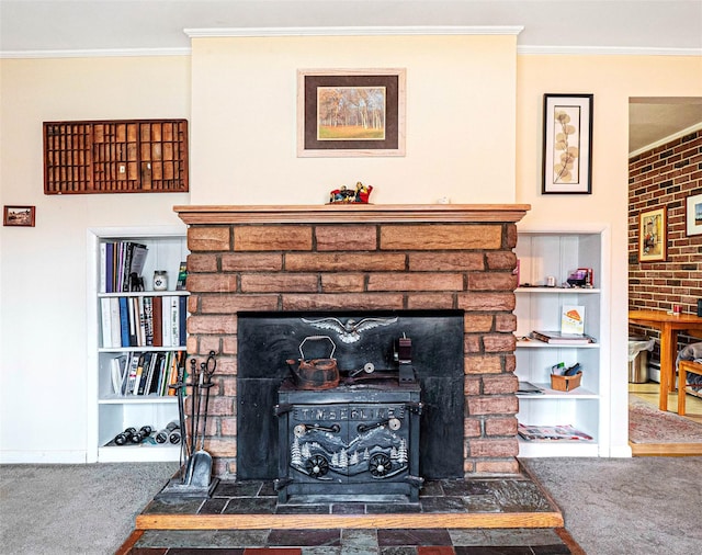 details featuring a fireplace with raised hearth, carpet floors, ornamental molding, and baseboards