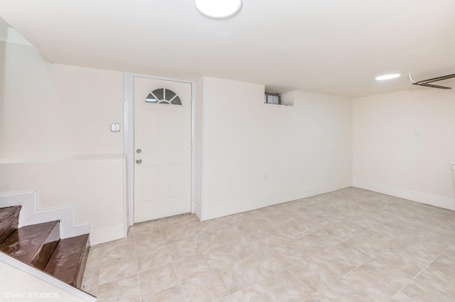 interior space with stairs and baseboards