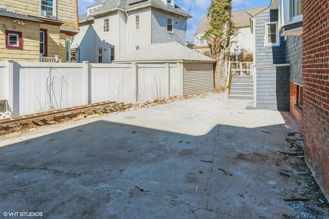 view of patio featuring fence