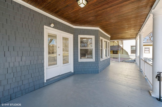 view of patio with covered porch and french doors