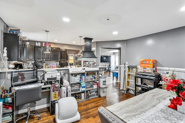 kitchen with island exhaust hood, light countertops, dark wood-type flooring, and recessed lighting