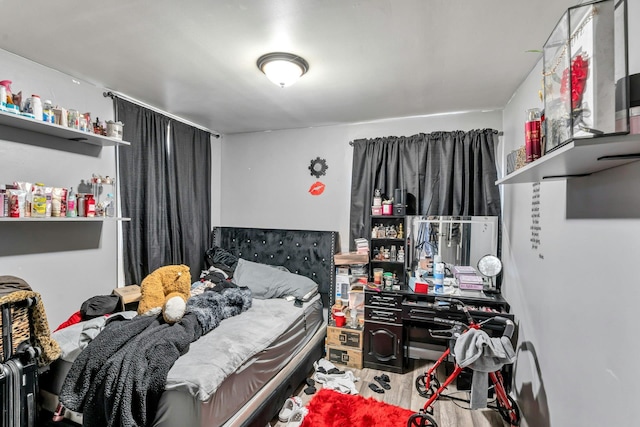 bedroom featuring wood finished floors