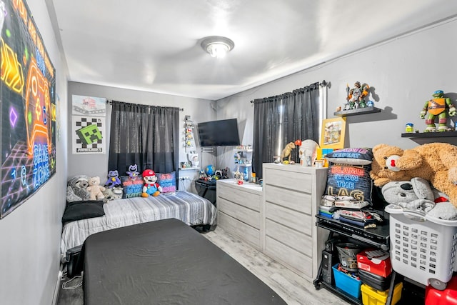 bedroom featuring wood finished floors