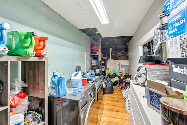 kitchen featuring a skylight and wood finished floors