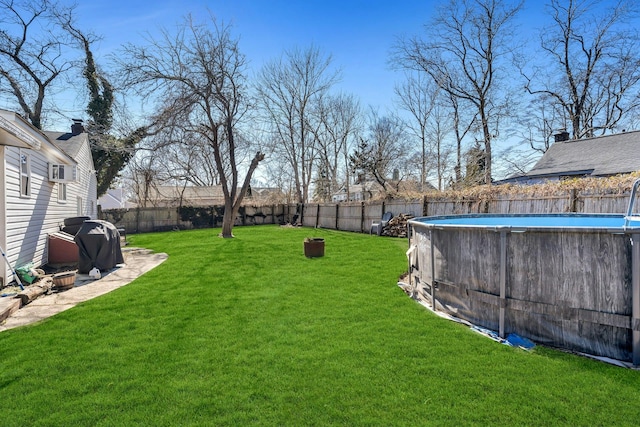 view of yard with a fenced backyard and a fenced in pool