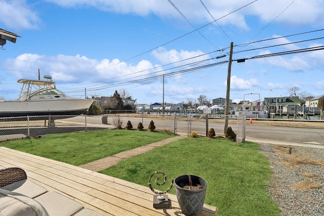 view of yard featuring fence and a residential view