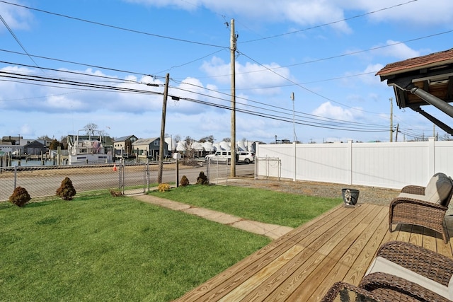 view of yard with a fenced backyard and a wooden deck