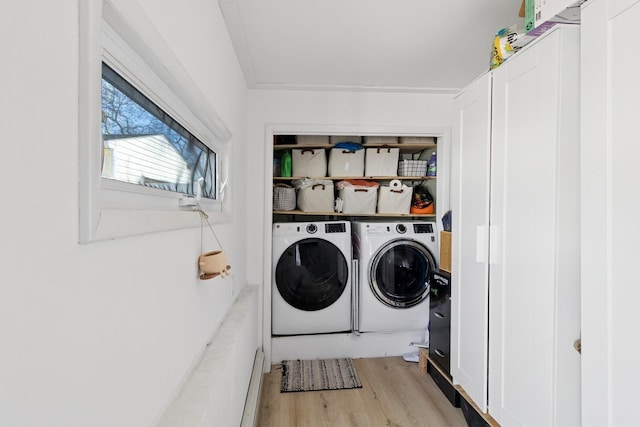 clothes washing area with laundry area, light wood-style flooring, and independent washer and dryer