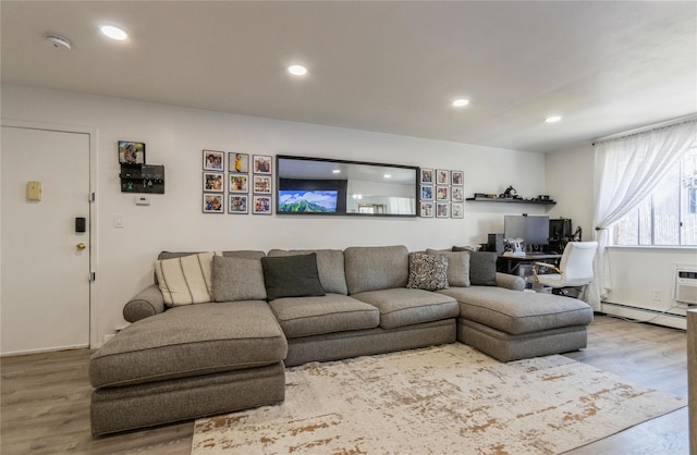 living area with baseboard heating, recessed lighting, and wood finished floors