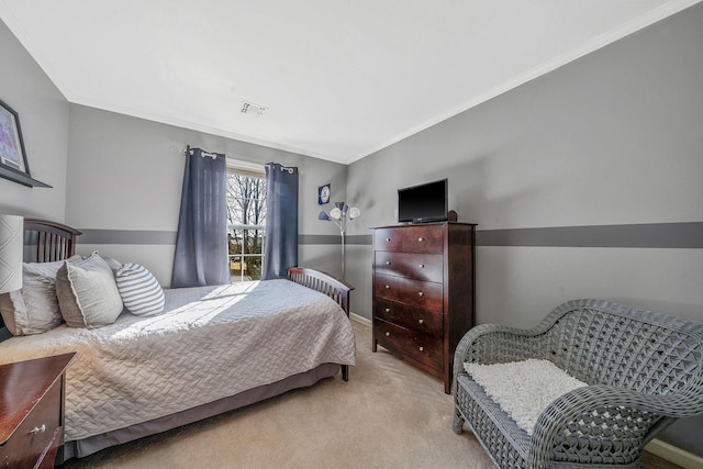 carpeted bedroom with baseboards, visible vents, and crown molding