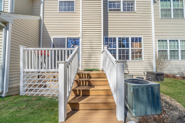 entrance to property featuring cooling unit