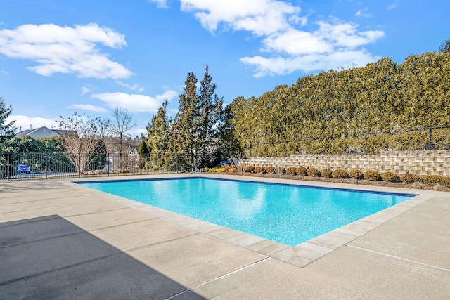 view of pool with a fenced in pool, fence, and a patio