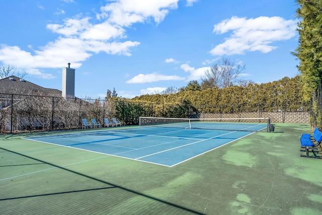 view of tennis court with fence