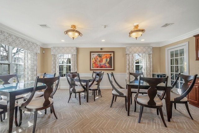 dining space with recessed lighting, visible vents, carpet flooring, and ornamental molding