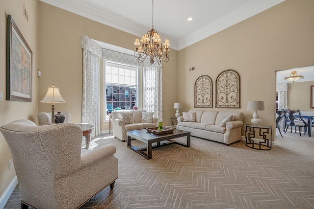 carpeted living area with visible vents, baseboards, an inviting chandelier, a high ceiling, and crown molding