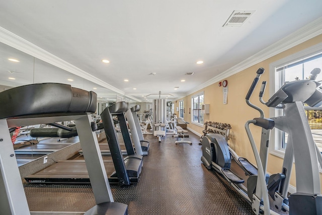 workout area with baseboards, recessed lighting, visible vents, and crown molding