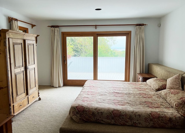 29 Kenwood Rd, Southampton, NY 11968 - bedroom with access to outside and light colored carpet