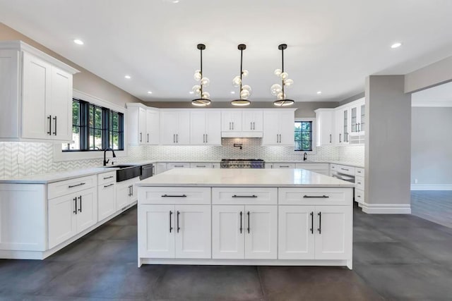 kitchen featuring light countertops, stove, and white cabinets