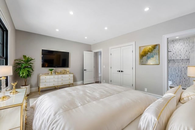 bedroom with baseboards, a closet, and recessed lighting