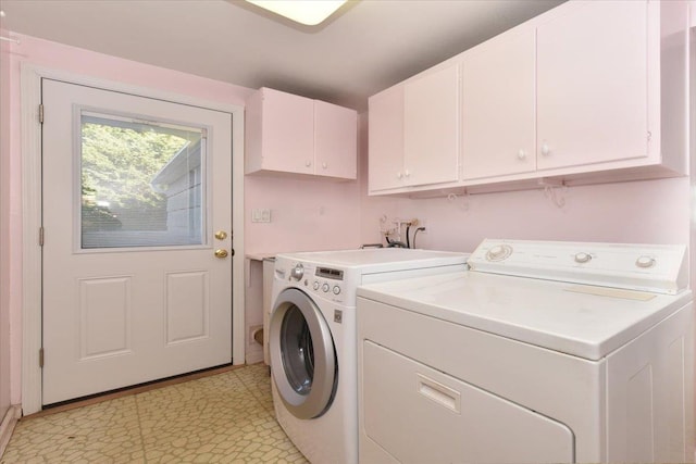 laundry area with cabinet space and washing machine and clothes dryer