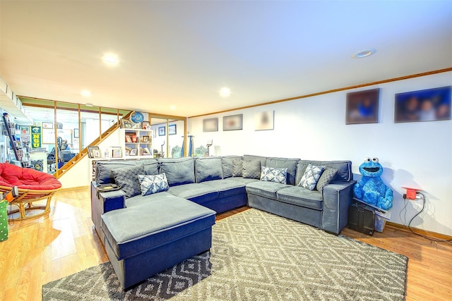 living room with baseboards, wood finished floors, stairs, crown molding, and recessed lighting