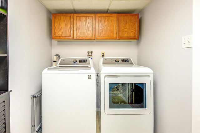 laundry area with cabinet space and washer and clothes dryer