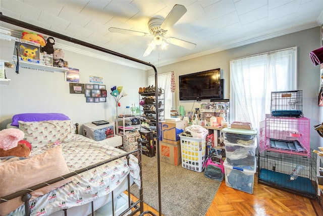 bedroom with a ceiling fan and crown molding