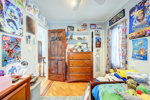 bedroom featuring ceiling fan and crown molding