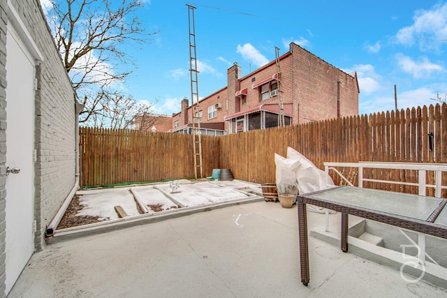 view of patio featuring fence