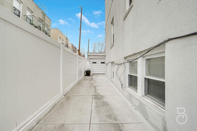 view of patio featuring fence