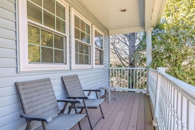 wooden terrace with a porch