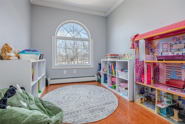 interior space with ornamental molding, a baseboard radiator, and wood finished floors