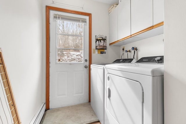 laundry area with light colored carpet, washer and dryer, cabinet space, and a baseboard radiator