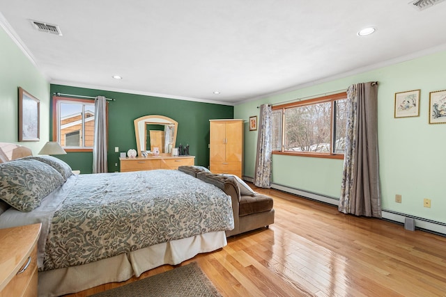 bedroom with recessed lighting, a baseboard heating unit, wood finished floors, visible vents, and ornamental molding