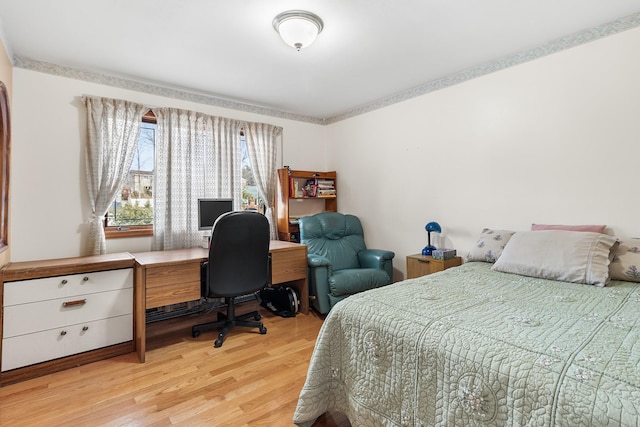 bedroom featuring light wood-style floors