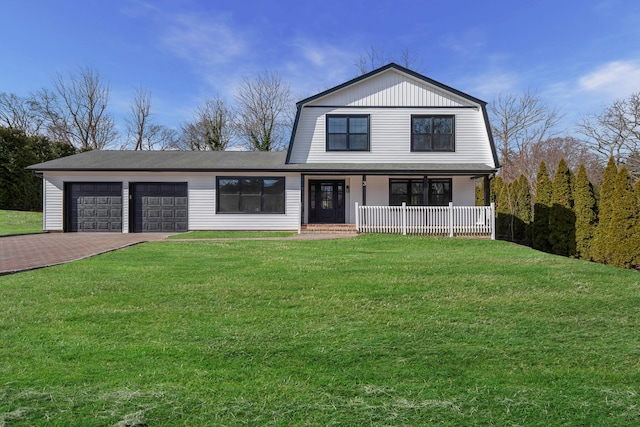 dutch colonial with a porch, a gambrel roof, decorative driveway, and a front lawn